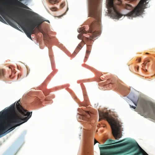 fingers in the shape of a star-team building